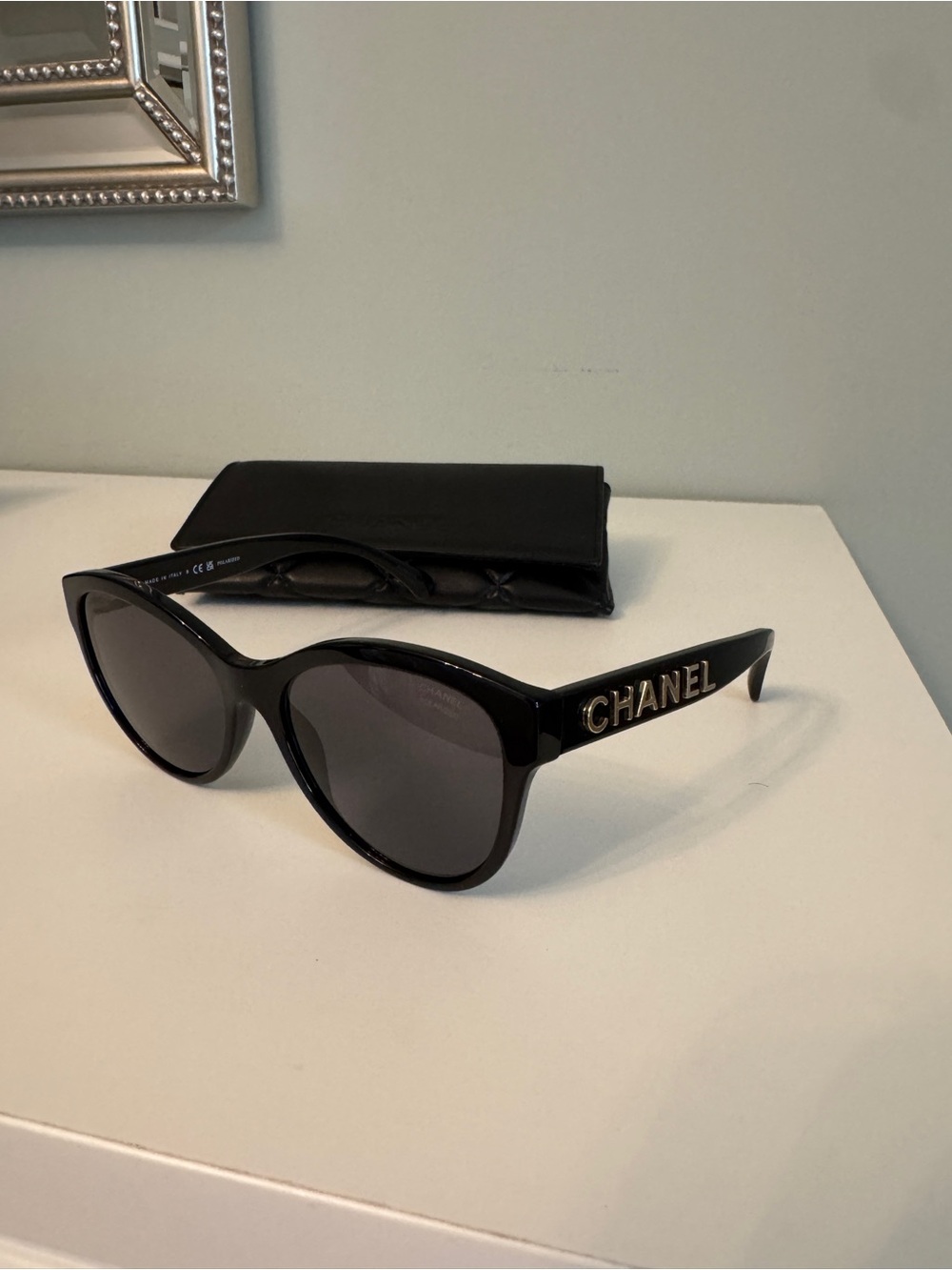 CHANEL Black Cat-Eye Sunglasses with Gold Logo Temples